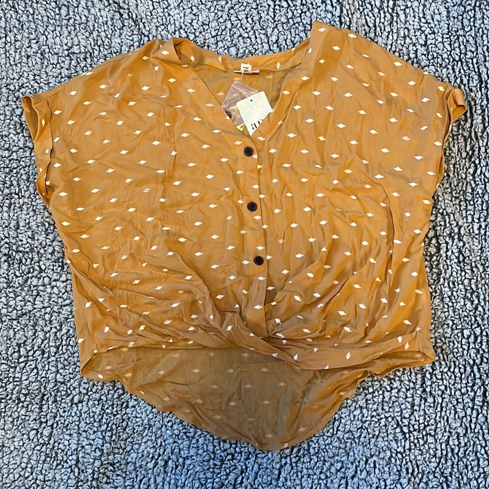 a.n.a. Gold tee Never Worn!